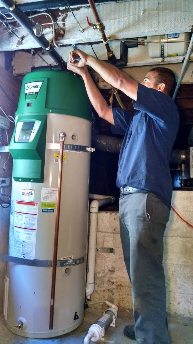 plumber providing water heater services 
